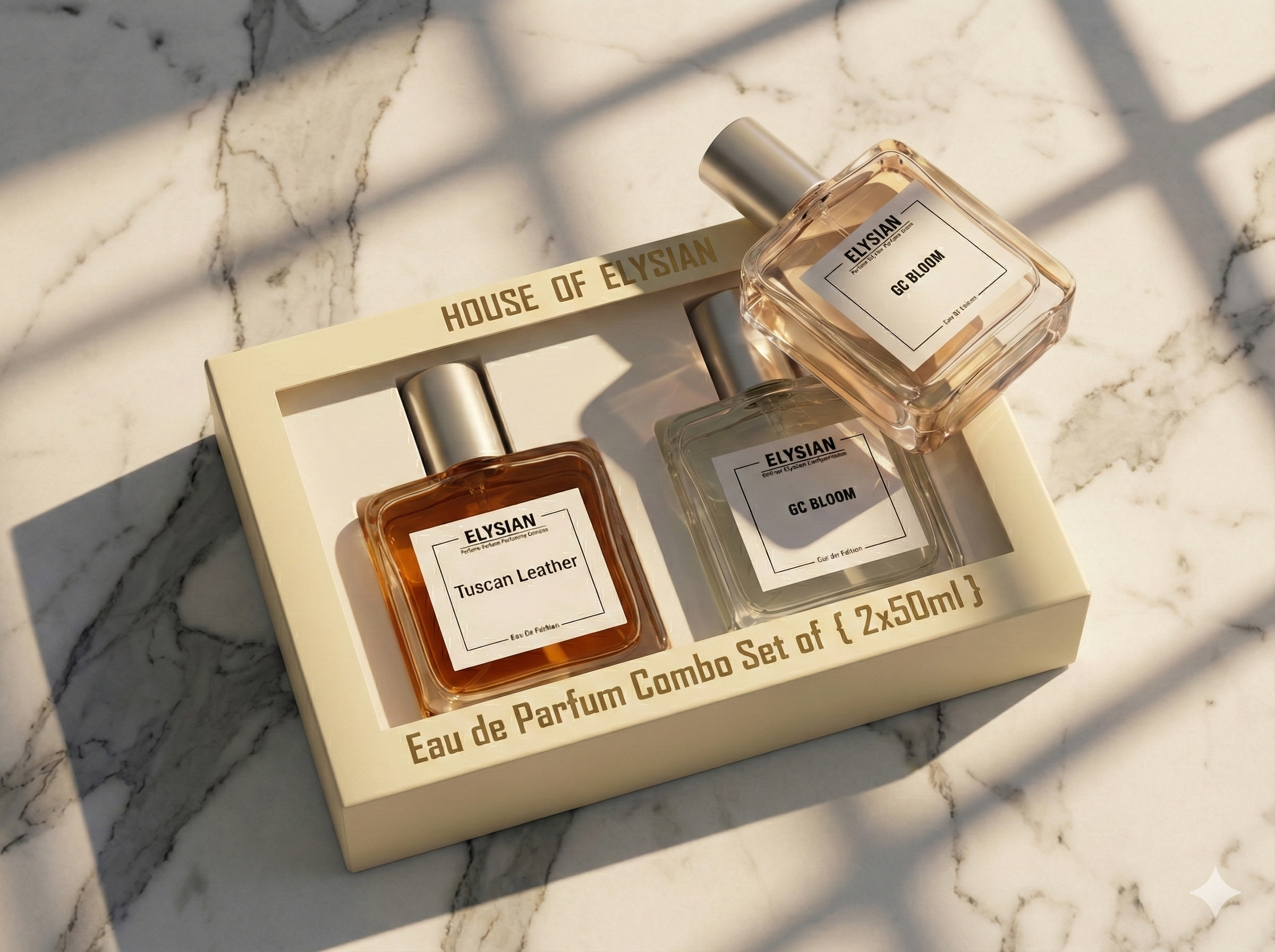 Two Elysius perfume bottles in a box on a marble surface