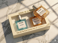 Two Elysian perfume bottles in a box on a marble surface