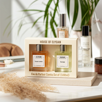House of Elysian perfume set on a table with a blurred background
